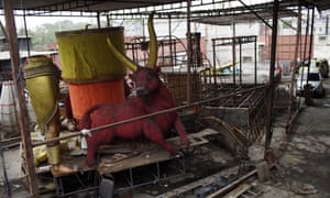 Carnival parade floats sit unfinished in the Unidos de Padre Miguel samba school workshop, in Rio de Janeiro, Brazil, Monday, 21 September 2020.