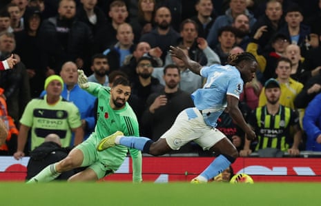 Liverpool's Giorgi Mamardashvili concedes a penalty against Manchester City's Jeremy Doku.
