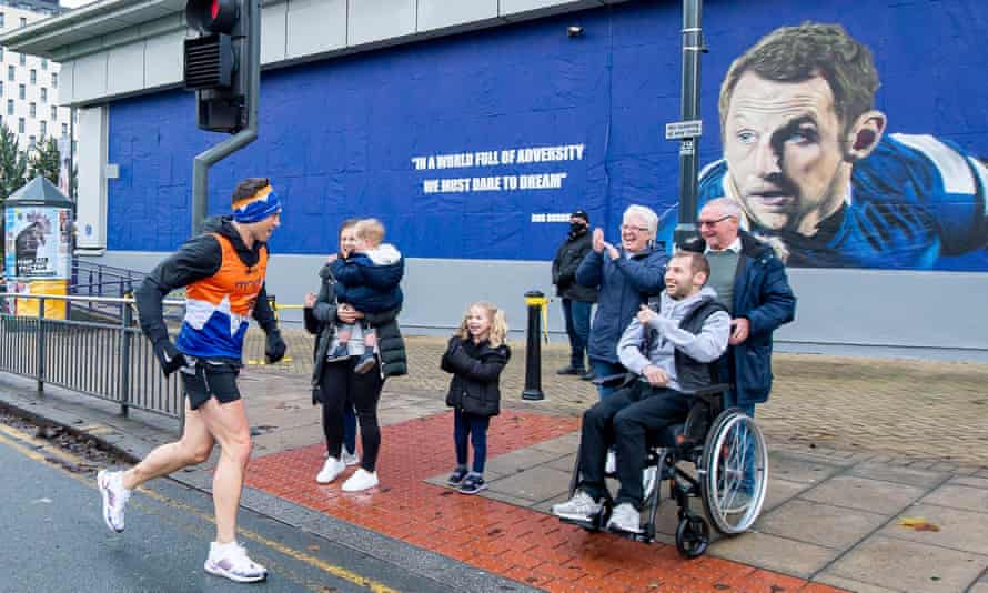 Kevin Sinfield greets Rob Burrow on day 5 of his seven marathons in seven days fundraising challenge for the Motor Neurone Disease Association.