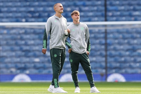 Gustaf Lagerbielke and Odin Thiago Holm of Celtic inspect the Ibrox pitch