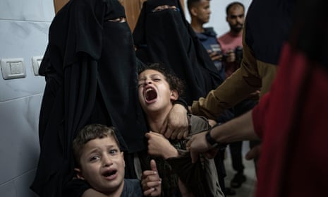 Palestinians mourn their relatives killed in the Israeli bombardment of the Gaza Strip.