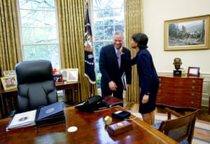 Powell receives a pat on the cheek from the national security adviser, Condoleezza Rice
