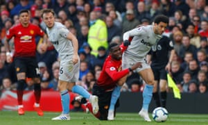 Manchester United’s Paul Pogba tussles with West Ham’s Felipe Anderson as Mark Noble looks on.