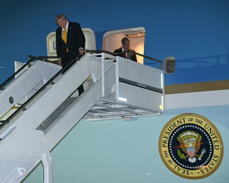 Donald Trump disembarks from Air Force One upon arrival at Royal Air Force Mildenhall in eastern England on 8 July.