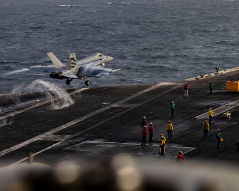A fighter jet takes off from aircraft carrier USS Abraham Lincoln on 31 July, which has been deployed for a record-breaking 250 days.Photograph: US NAVY/NAVCENT PUBLIC AFFAIRS/AFP/Getty Images