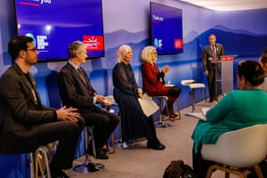 Nadine Dorries, the UK's secretary of state for digital, culture, media and sport (third left) speaks in a session in the UK pavilion