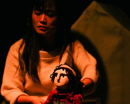 Woman holding a fabric puppet
