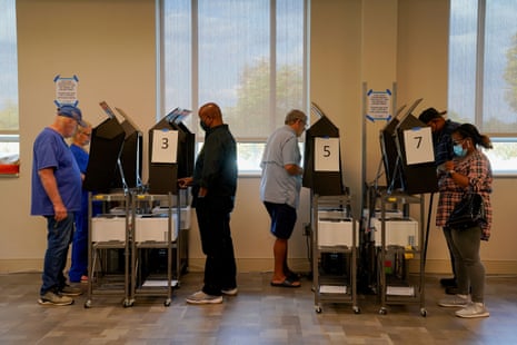 People use voting machines to vote early in Columbus, Georgia, on 17 October.