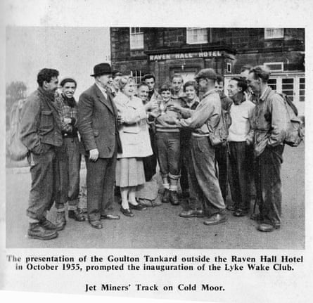 Bill Cowley (flat cap) being given a commemorative tankard in Ravenscar with the rest of the group who completed the first Lyke Wake Walk in October 1955. Malcolm Walker is wearing the white jumper second from the right .