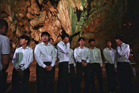 Members of the Thai Wild Boars youth football team gather inside the Tham Luang cave in the Mae Sai district in the northern province of Chiang Rai, 10 July, to mark the five-year anniversary of their rescue from inside the flooded cave