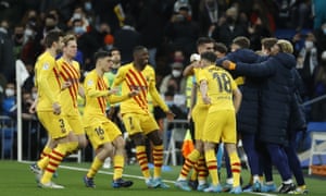 Barcelona players celebrate their 3-0 lead .