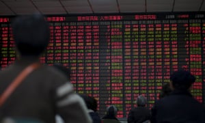 Stock information at a brokerage house in Shanghai: markets on Friday were volatile after Beijing ditched a circuit breaker that halted trading twice this week.