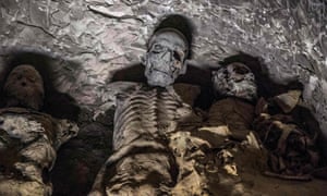 A group of mummies stacked together at the Al-Assasif necropolis.