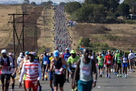 Runners all along a road