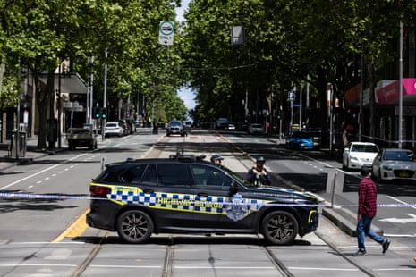 Police at a closed off Bourke Street on Sunday.