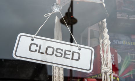 A closed sign in a shop window in Bagshot, Surrey, during the coronavirus lockdown.