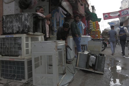 Nazim Khan (L), at his AC rental shop in Shaheen Bagh, Delhi.