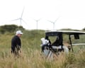 Donald Trump on his Aberdeenshire golf course with wind turbines in the background