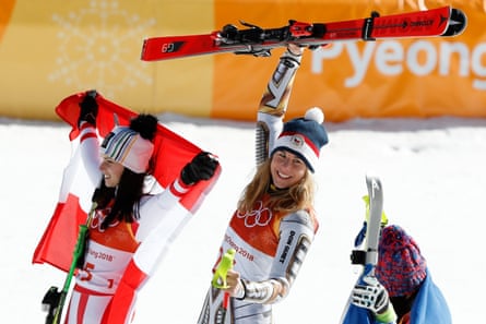 Ester Ledecka (centre) celebrates alongside Anna Veit (left) and Tina Weirather during the victory ceremony for the Super-G at the 2018 Winter Olympics
