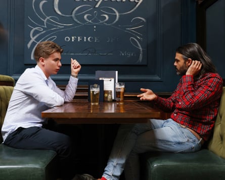 Hugo and William chat across a restaurant table
