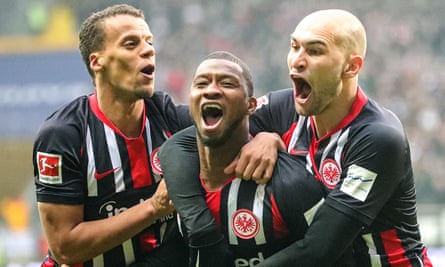 Eintracht Frankfurt’s Almamy Toure (centre) celebrates with teammate Timothy Chandler (left) and Bas Dost after scoring against RB Leipzig.