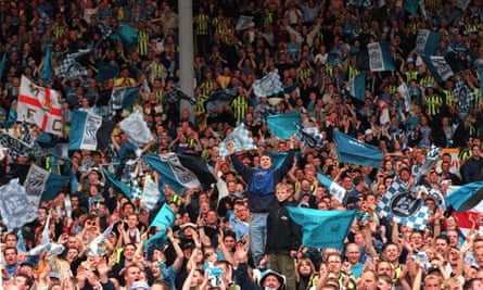 Manchester City fans cheer on their team at Wembley.