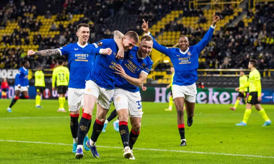 John Lundstram celebrates his goal for Rangers at Signal Iduna Park.