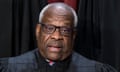 Middle-aged Black man with balding pate and white hair, glasses, in black judicial robes, appears to speak.