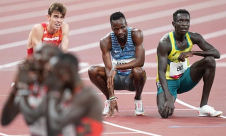 Peter Bol (right) fails to find solace from the scoreboard at Tokyo Olympic Stadium after being overhauled by Emmanuel Korir and Ferguson Rotich (bottom left) and Poland’s Patryk Dobek.