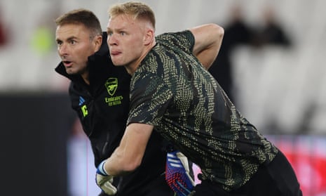 Arsenal's Aaron Ramsdale with goalkeeping coach Inaki Cana during the warm up before the Carabao Cup fourth round match at West Ham.