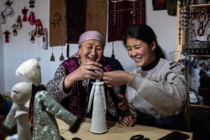 BuunTereshkovakova shows a participant how to make a doll's hair during a master class in the working room of the ethnic museum in Sary-Mogol.