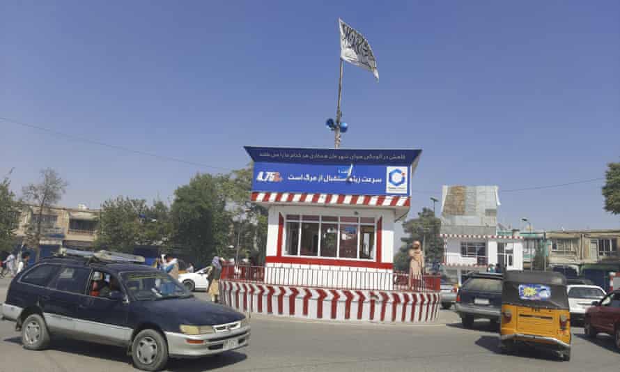 A Taliban flag flies in the main square of Kunduz