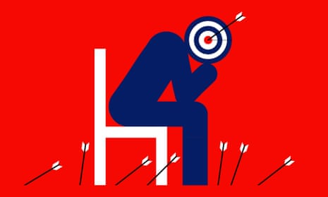 Figure sitting on a chair, its head is a target with an arrow on the bullseye
