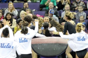 UCLA gymnast Kyla Ross celebrates with teammates after scoring a perfect 10 on the vault during a meet between the UCLA Bruins and the Washington Huskies in February 2019.