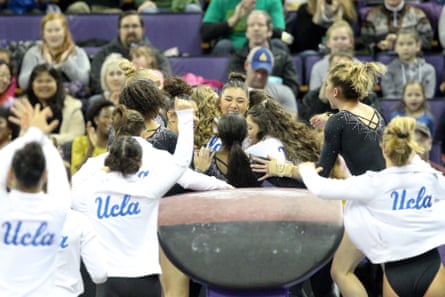 UCLA gymnast Kyla Ross celebrates with teammates after scoring a perfect 10 on the vault during a meet between the UCLA Bruins and the Washington Huskies in February 2019.