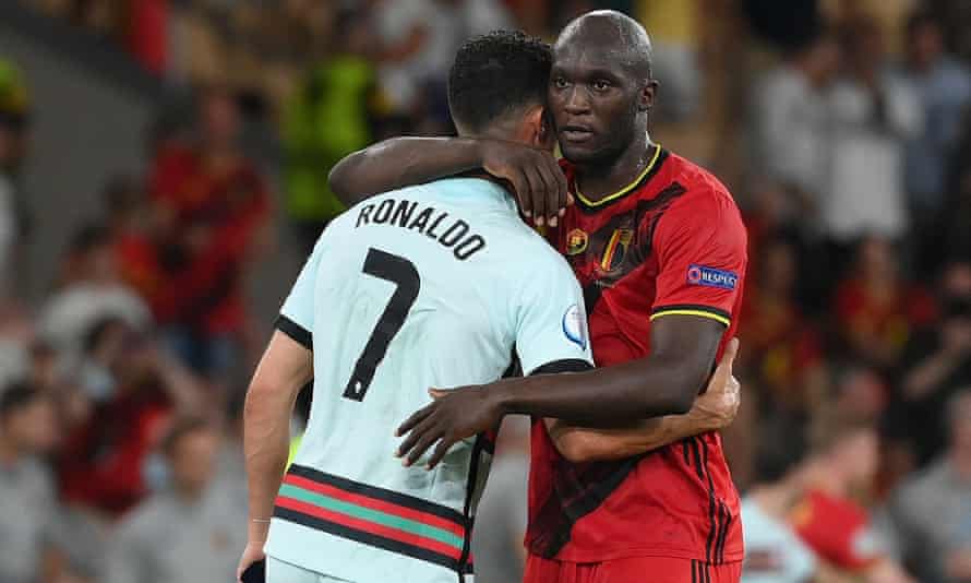 Ronaldo and Romelu Lukaku embrace after the final whistle in Seville. The Belgian, on three goals, could yet deny Ronaldo, who has five, the Euro 2020 Golden Boot.