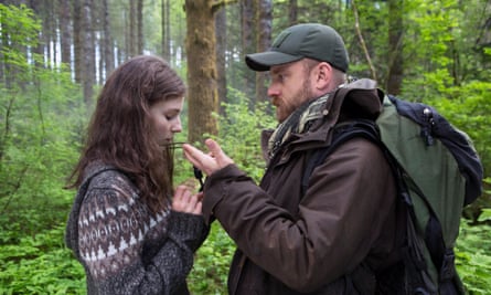 Father and adult daughter in the woods