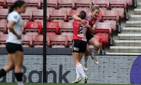 Emma Thompson of Southampton FC celebrates scoring her team's first goal against Lewes in March with teammate Ella Morris