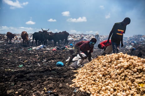 Children sort through the waste in a dump in Senegal.