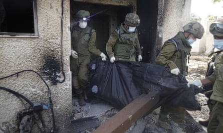 Soldiers with masks carrying black bodybag