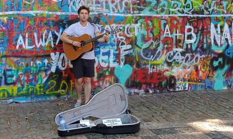 A busker at the Lennon wall, one of Prague’s leading cultural attractions.