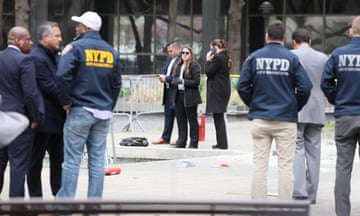Emergency personnel respond to a report of a person covered in flames outside the courthouse where Donald Trump’s criminal hush money trial is underway