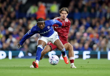 Ipswich Town's Abdul Fatawu in action with Liverpool's Milos Kerkez.