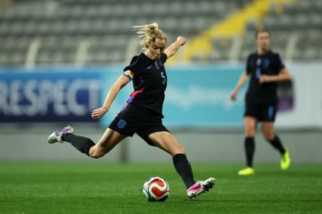 England captain Leah Williamson prepares to hit a shot with her right boot.