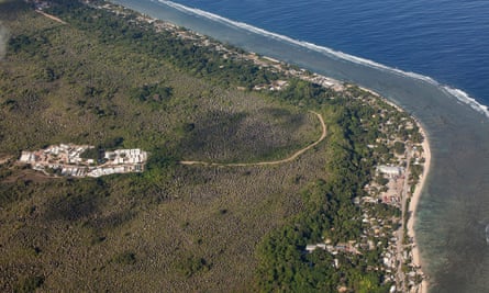 Aerial view of a building complex inland from the shoreline