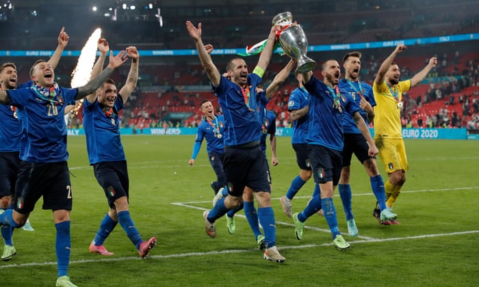 Giorgio Chiellino and Leonardo Bonucci celebrates with the trophy in front of the Italian fans.