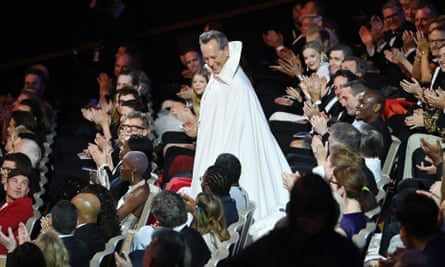 Richard E Grant enters.