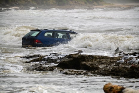 Sydney awaits 'soggiest weekend of summer' as Victorian authorities defend flash flood warnings | Australia weather | The Guardian