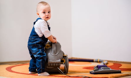 Baby with a vacuum cleaner