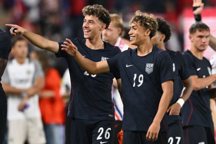 Adri Mehmeti and Julian Hall acknowledge the crowd during a USMNT game.